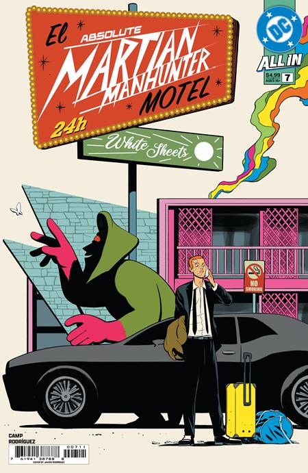 Comic book cover featuring a Martian Manhunter motel sign and a man with a suitcase.