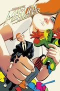 Comic book cover featuring a character holding a knife and small figures, with 'Absolute Martian Manhunter' text at the top.
