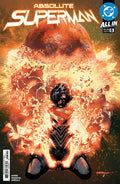 Comic book cover of 'Absolute Superman' with a dynamic pose and fiery background.