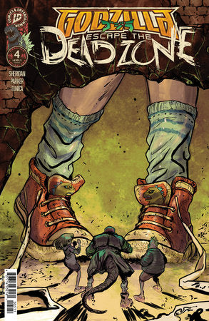 Comic book cover of 'Godzilla: Escape the Dead Zone' with a person's feet and small creatures.